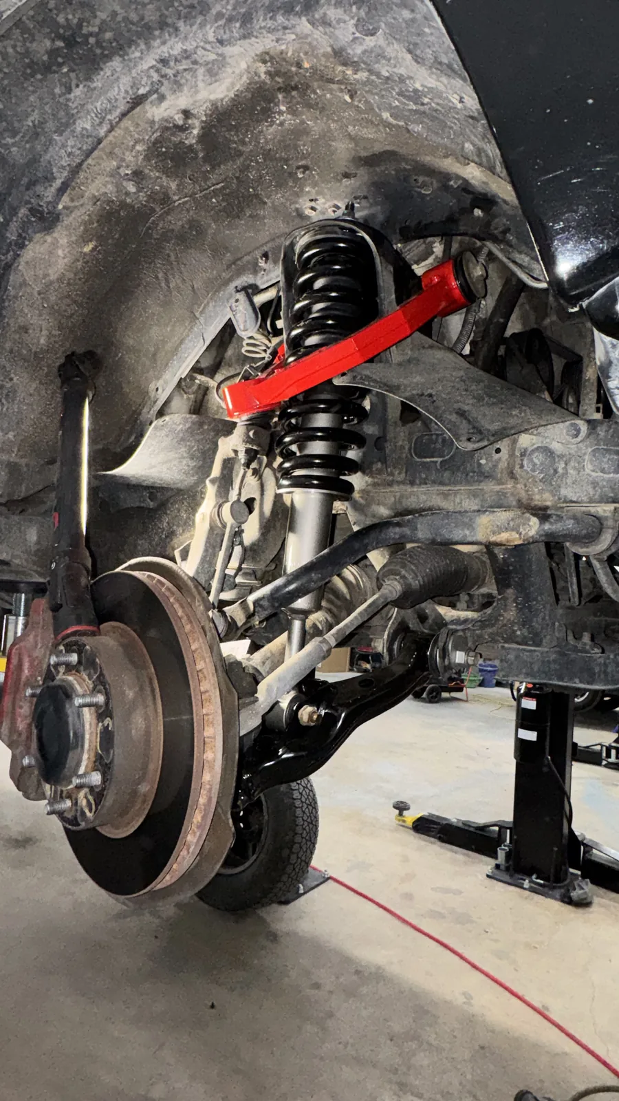Suspension and brake components undergoing service